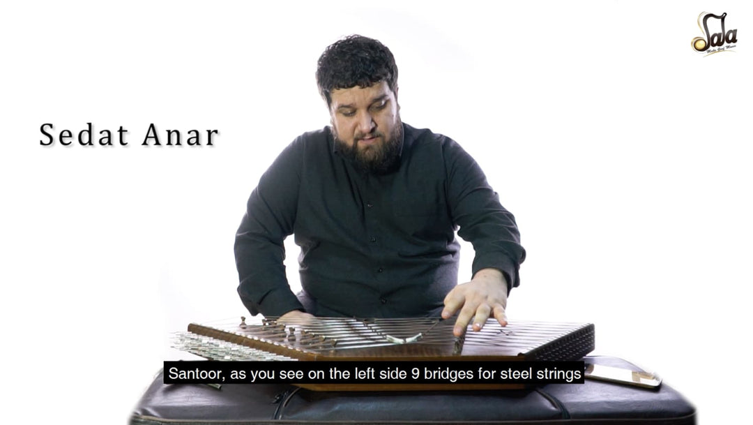 Persian santoor hammered dulcimer tuned with mezrab mallets across paired strings